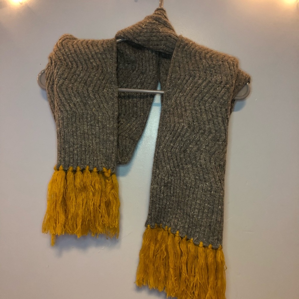 gray scarf with yellow tassels